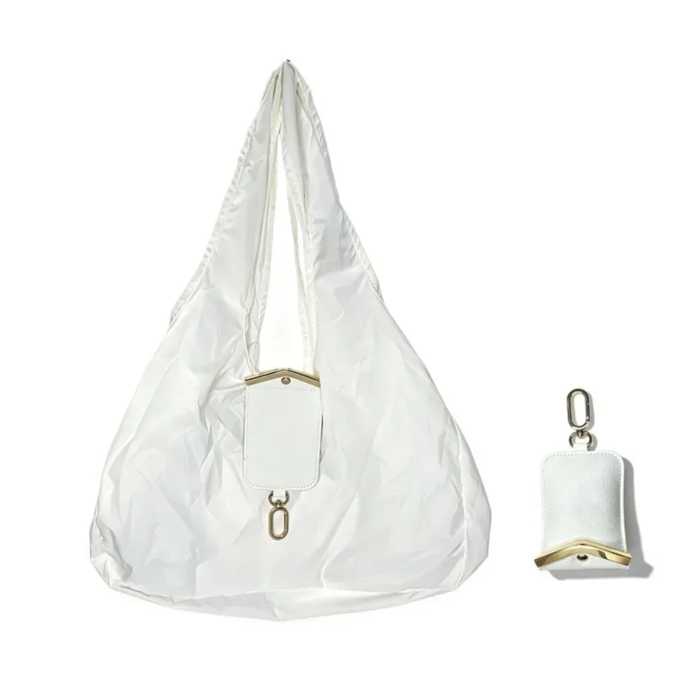sac fourre-tout mini pliable anti-déchirure en similicuir couleur unie avec porte-clés et garniture métallique, pochette 2-en-1 pour sac et breloque