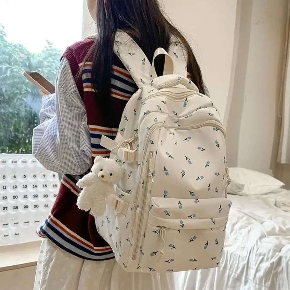 sac d'école en nylon pour étudiants, sac à dos de grande capacité de style preppy pour femmes avec pendentif, sac à dos de voyage à motif floral