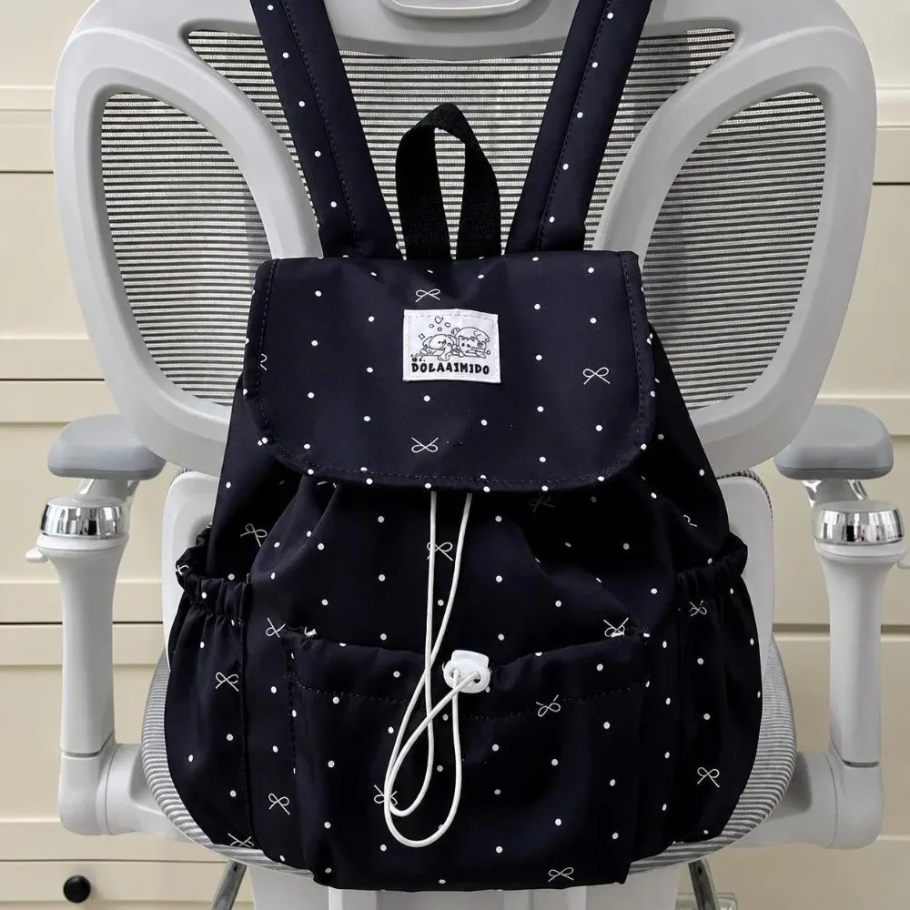 sac à dos à pois avec cordon de serrage, grande capacité, nœud décoratif, double bandoulière, ultra léger en nylon, idéal pour les trajets quotidiens et un usage décontracté.