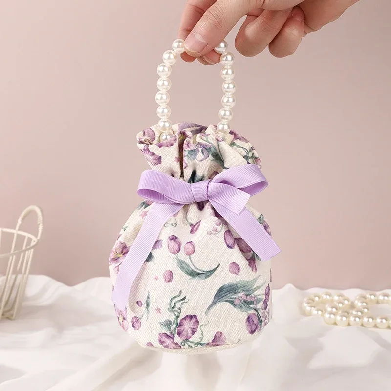 sac à cordon en toile florale, petite pochette à bijoux avec nœud papillon avec poignée en chaîne de perles, sac d'emballage de bonbons de mariage