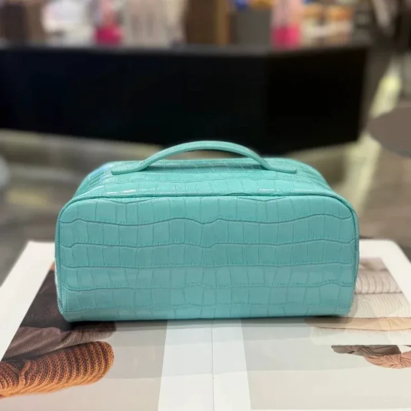 nouvelle trousse de maquillage en cuir véritable, motif crocodile, grande capacité, série de couleurs haut de gamme, sac de toilette portable de voyage