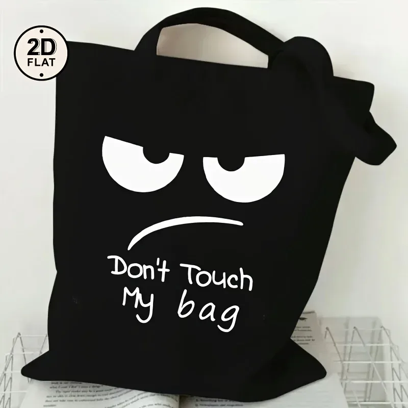 Un sac fourre-tout imprimé avec la mention « DON'TOUCH MY BAG », un sac à bandoulière noir décontracté, avec des bretelles fixes, convient pour le shopping.