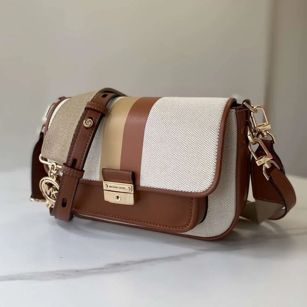 Sac à cadenas MK flambant neuf de la marque MICHAEL KORS, parfait pour les trajets quotidiens et les tenues de tous les jours