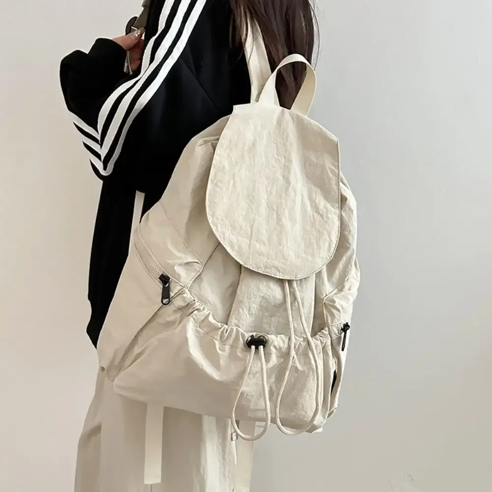 Sac à dos de voyage léger et simple, style coréen, imperméable, à cordon de serrage, grande capacité, en nylon, pour étudiants et adolescents.