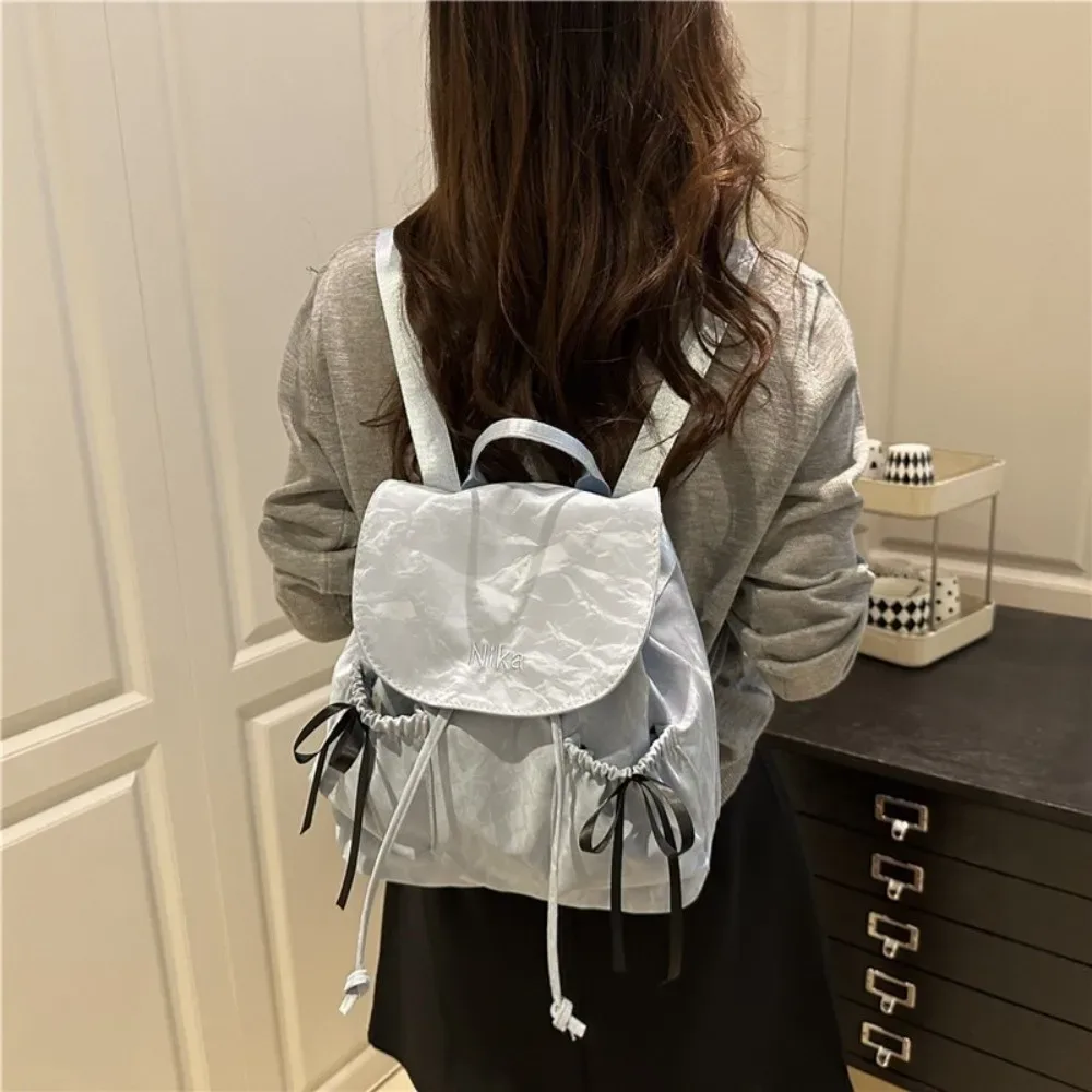 sac à dos à nœud mignon pour femmes, sac à dos avec cordon de serrage de grande capacité pour étudiants, sac de voyage de couleur unie pour l'extérieur