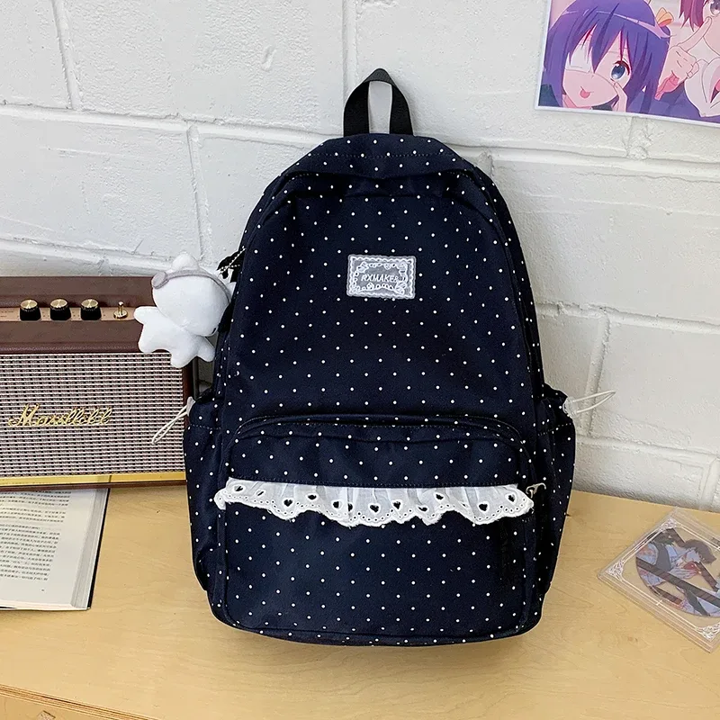 sac à dos tendance, sac d'école pour femmes à pois avec bordure en dentelle, mignon et élégant, sac à dos léger et de grande capacité pour étudiantes coréennes.