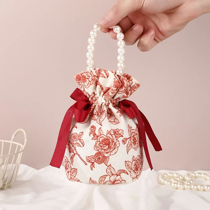 sac à cordon en toile florale, petite pochette à bijoux avec nœud papillon avec poignée en chaîne de perles, sac d'emballage de bonbons de mariage