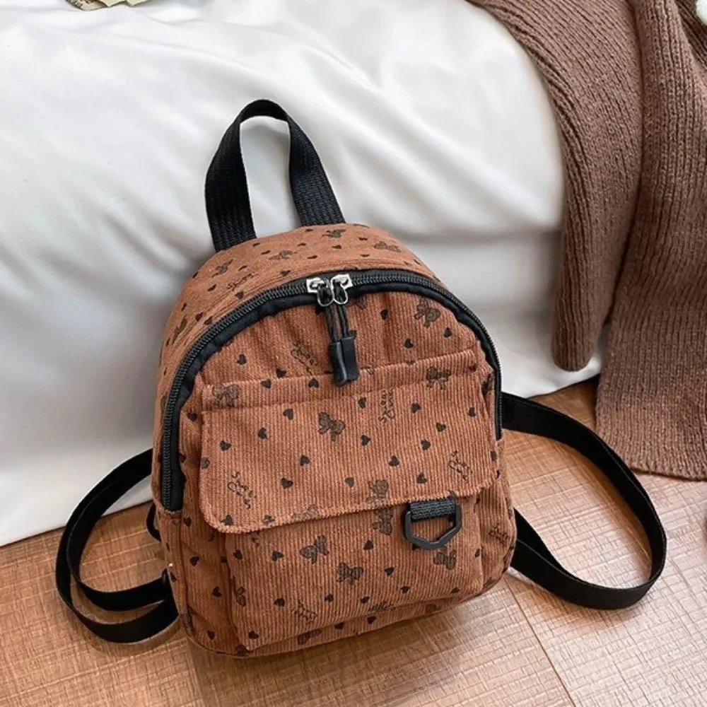mini sac à dos en velours côtelé imprimé cœurs et nœuds, léger, décontracté, multi-compartiments, ouverture zippée, sac à bandoulière pour les trajets quotidiens