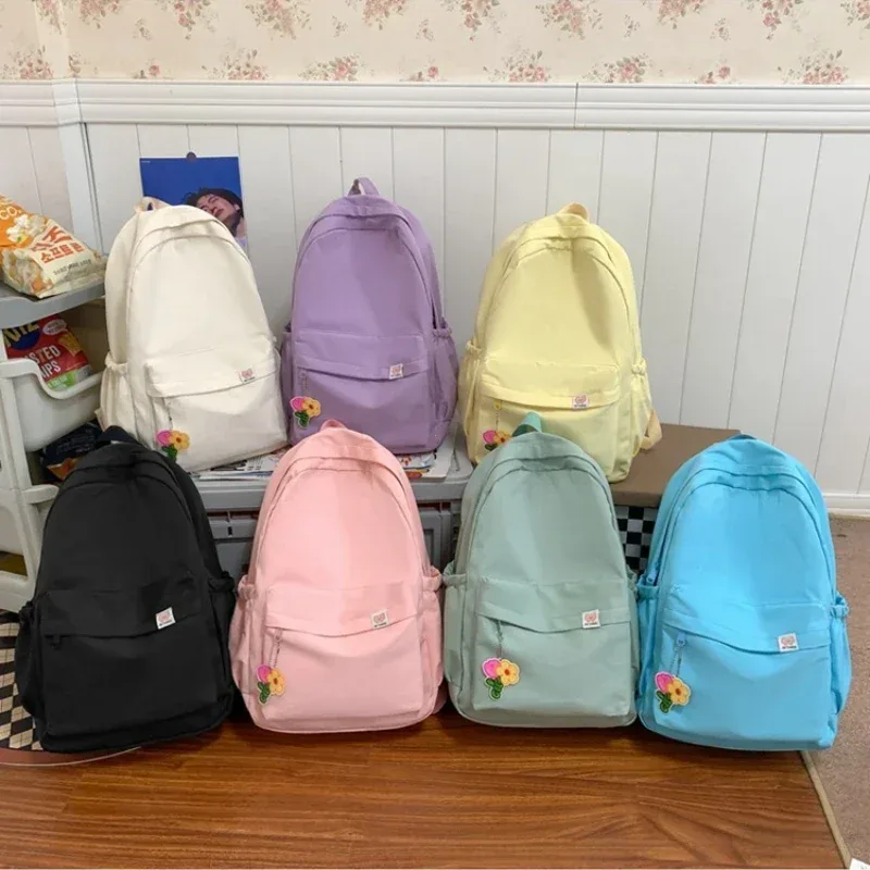 nouveau sac à dos imperméable en nylon pour femmes sac de voyage pour femmes sacs à dos cartable pour adolescentes couleur unie bookbag mochila bookbag