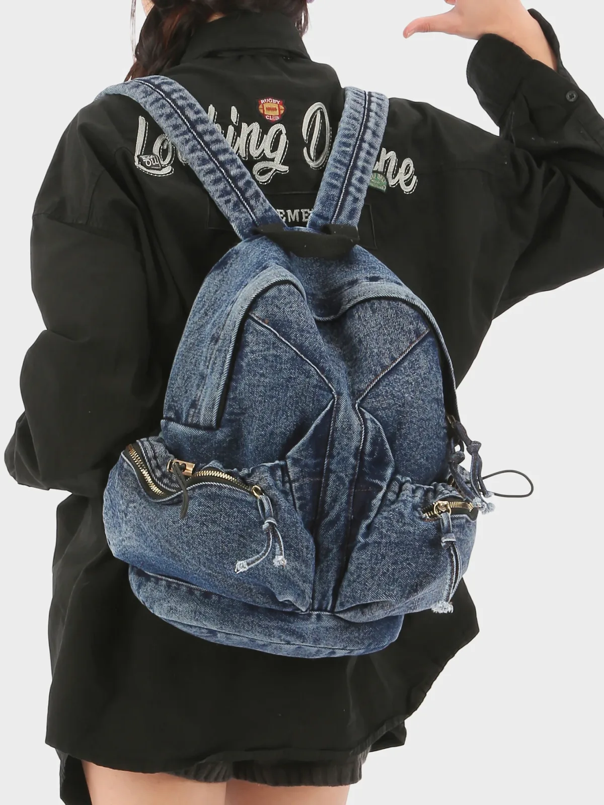 Sac à dos en jean délavé vintage pour femme, avec cordon de serrage, design déchiré, sac à dos décontracté pour l'école et les voyages