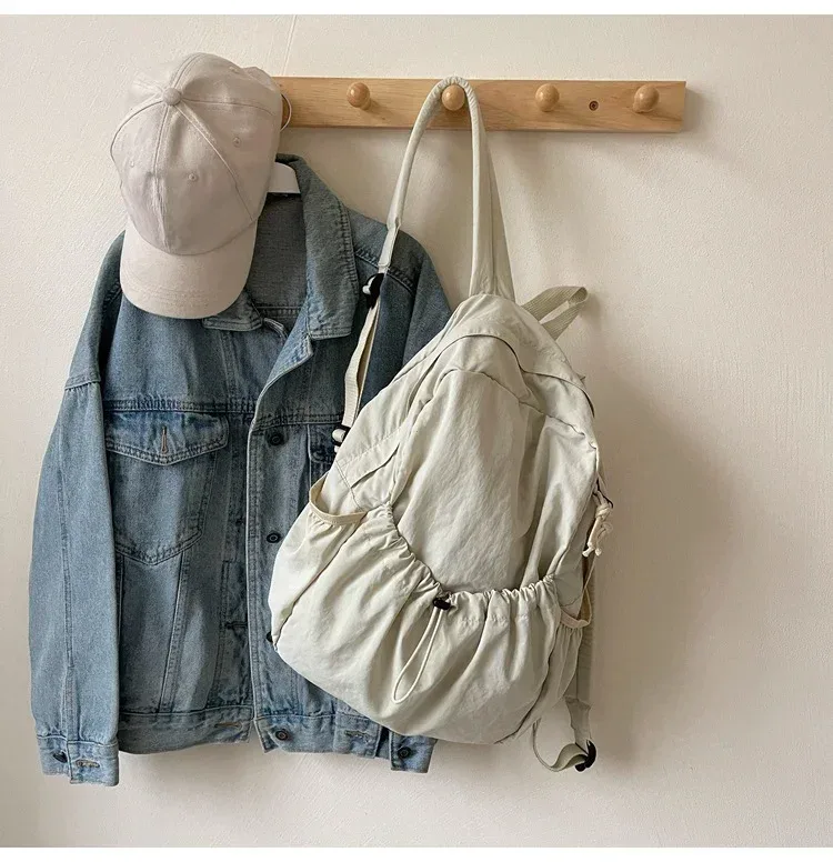 2025 sac à dos décontracté femmes grande capacité mode junior lycée étudiant pli cartable sac en tissu coréen voyage sac à dos