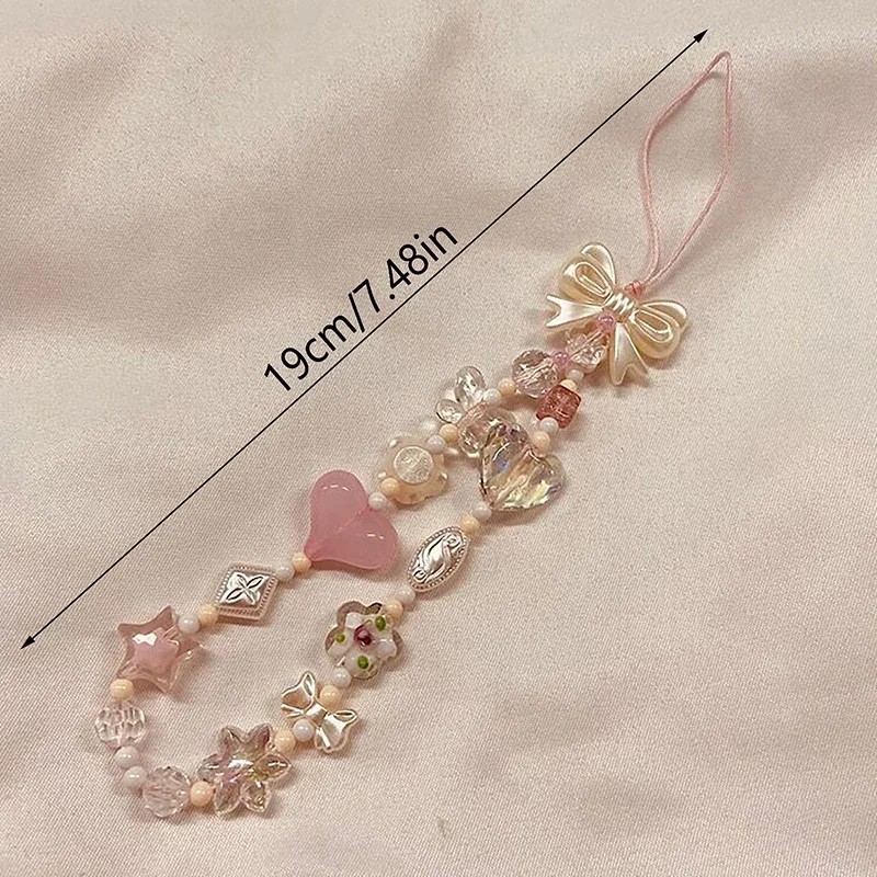 chaîne de téléphone, cordon de sac, porte-clés, breloque de sac à dos, cadeau, version coréenne du charmant motif fleur de cerisier rose avec nœud d'amour et perles