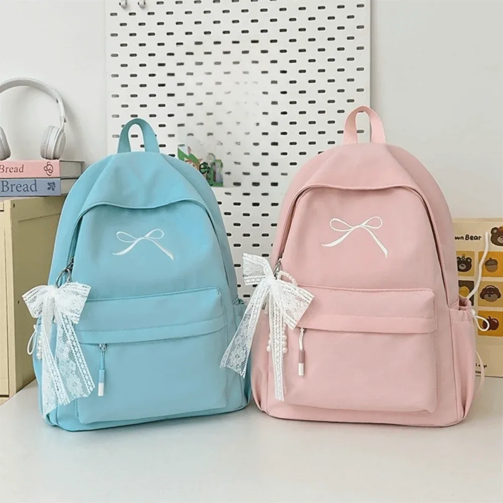 sac à dos portable avec nœud brodé pour filles, cartable en nylon de grande capacité pour étudiants, sac à dos de voyage léger de couleur unie
