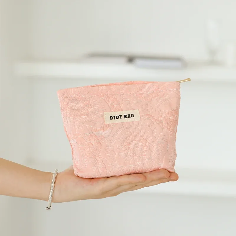sac à cosmétiques en relief rose noir pour femmes, sac de voyage portable, sac de rangement de changement de cosmétiques de grande capacité, pochette de banlieue