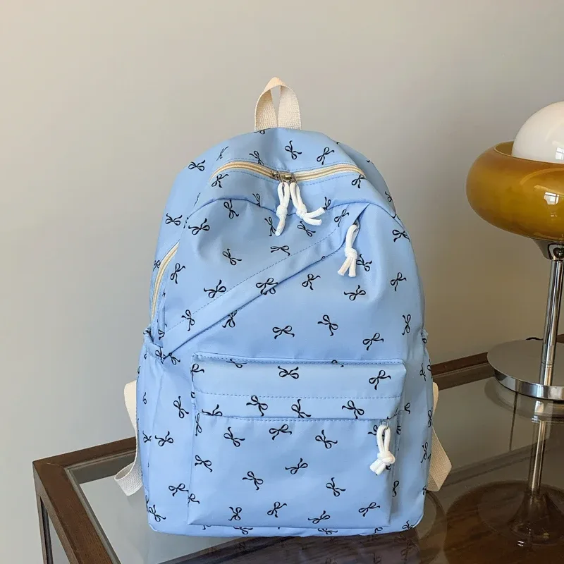 sac à dos tendance et mignon avec imprimé de nœuds, sac à dos pour ordinateur portable avec protection pour ordinateur portable, bretelles réglables, sac à dos pour ordinateur portable pour la rentrée scolaire.
