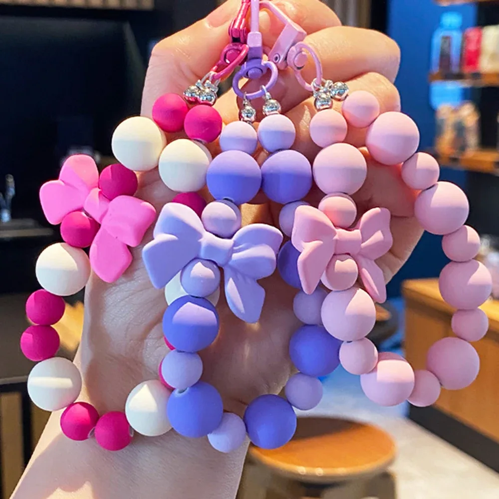 porte-clés avec nœud en perles roses, chaîne pour téléphone portable, sac pour écouteurs, corde anti-perte, porte-clés de voiture, pendentif perlé, accès au pendentif pour sac à dos