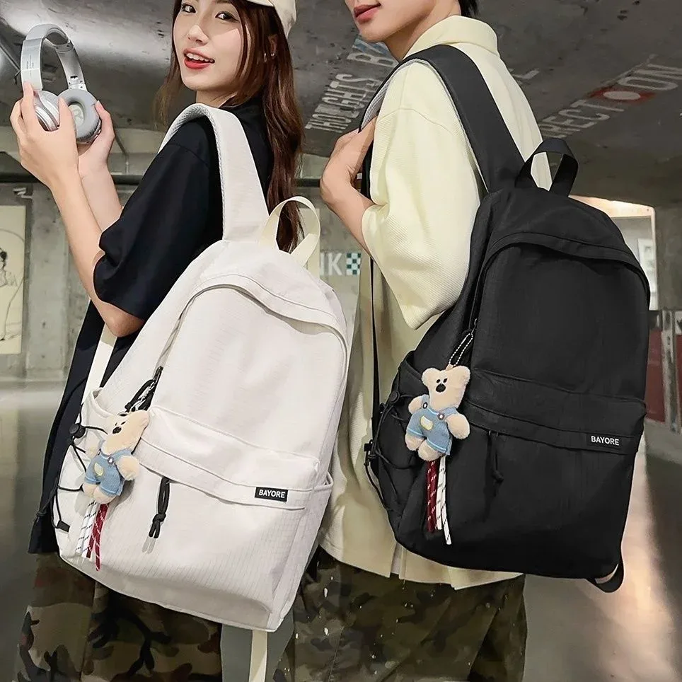 sac à dos de voyage décontracté grande capacité pour homme, motif quadrillé simple, sac d'école en nylon, style campus jeune, système anti-gravité