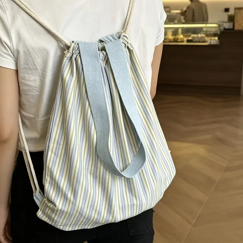 Sac à dos en toile rayée grande capacité, style britannique, pour jeunes, avec cordon de serrage, idéal pour les trajets quotidiens