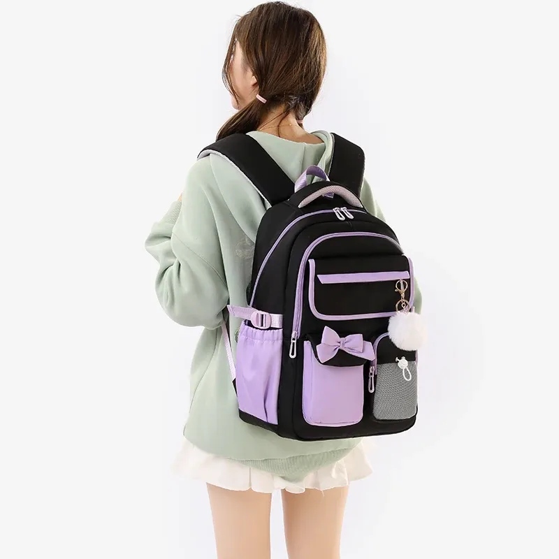 nouveau sac à dos scolaire en nylon grande capacité 2026 pour filles, sac à dos tendance avec nœud et couleurs bonbon, sac à livres pour adolescentes, sac à dos de voyage