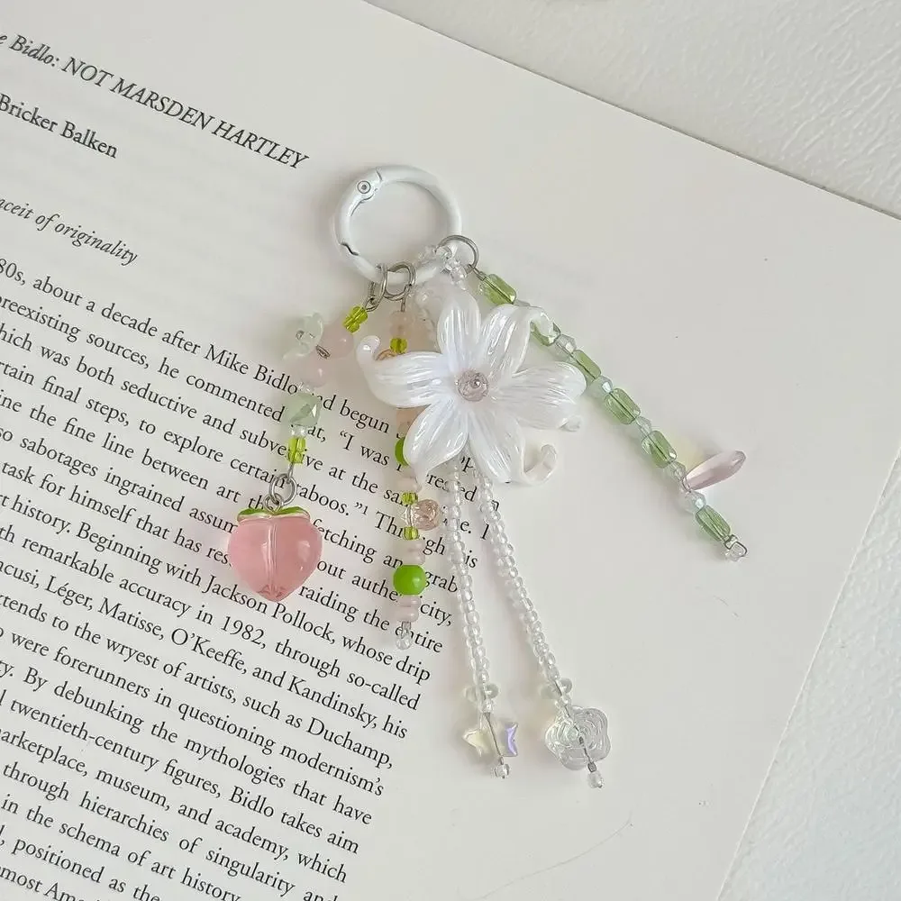 porte-clés fleur rose mignon avec perles en acrylique et cristaux, breloque de sac à pompon pour la décoration de sacs à main et sacs à dos