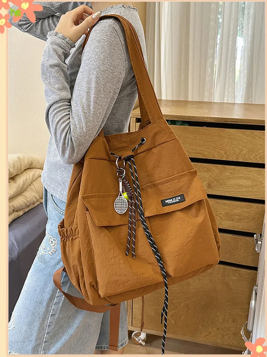 sac à dos de voyage 2-en-1 pour femmes, léger, de style coréen, décontracté, sac à bandoulière multifonctionnel avec cordon de serrage pour étudiantes.