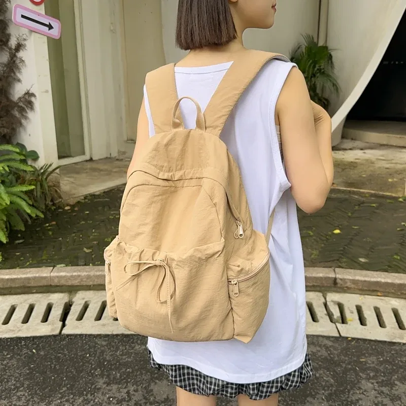 nouveau sac à dos mignon de couleur unie pour femmes, sac à dos de loisirs en nylon pour étudiantes, cartable pour adolescentes, sac à dos de voyage à la mode