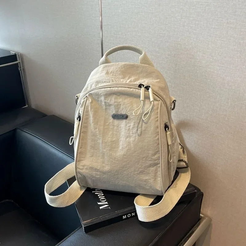 mini sac à dos multifonctionnel en nylon, sac de voyage convertible décontracté à bandoulière pour femme, sac à dos quotidien multi-poches pour l'extérieur