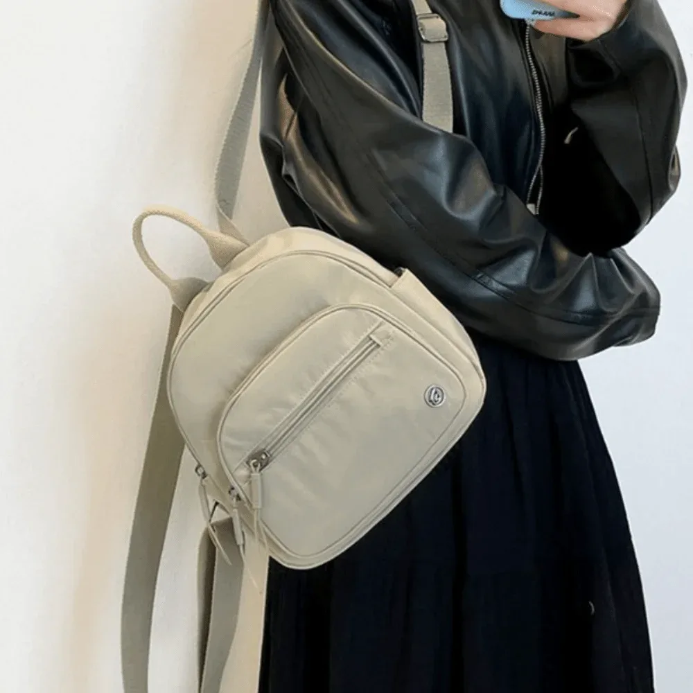 sac à dos portable pour femmes en nylon léger, couleur unie, multi-poches, décontracté et tendance avec poignée