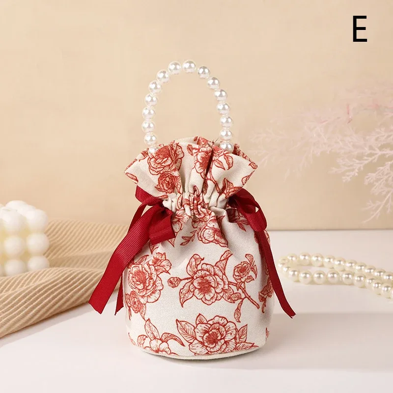 sac à cordon en toile florale, petite pochette à bijoux avec nœud papillon avec poignée en chaîne de perles, sac d'emballage de bonbons de mariage