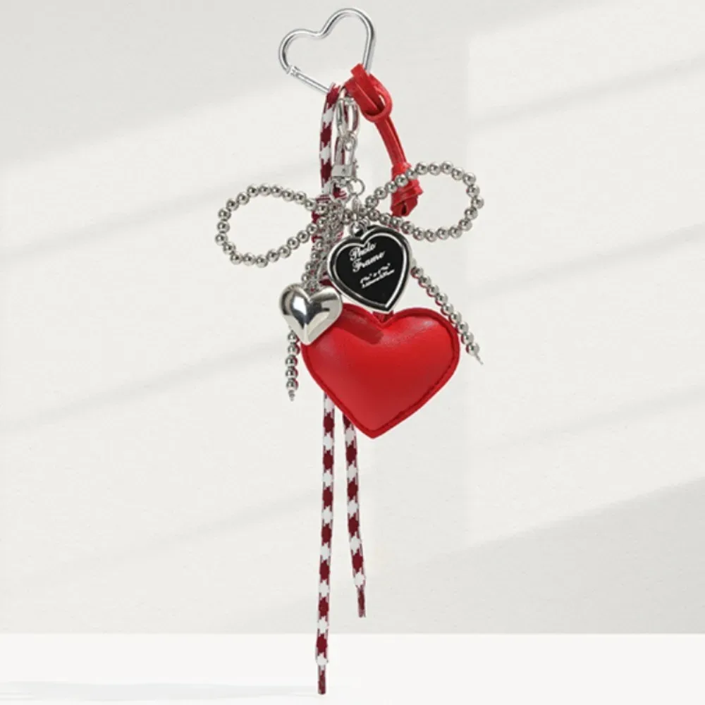 Porte-clés créatif en cuir brillant avec nœud perlé, longue pampille, cœur d'amour, pendentif pour sac à dos, breloque de sac faite à la main, décoration pour sac à main quotidienne