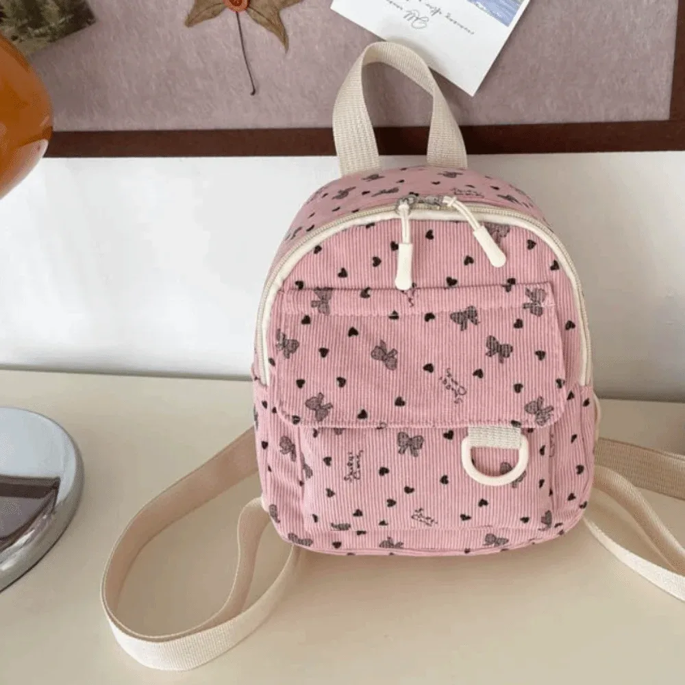 mini sac à dos en velours côtelé léger avec imprimé cœur et nœud, sac à dos décontracté multi-compartiments à ouverture zippée, sac à bandoulière de voyage