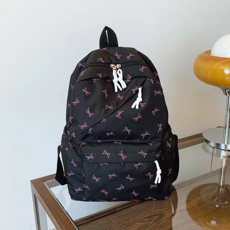 sac à dos tendance et mignon avec imprimé de nœuds, sac à dos pour ordinateur portable avec protection pour ordinateur portable, bretelles réglables, sac à dos pour ordinateur portable pour la rentrée scolaire.
