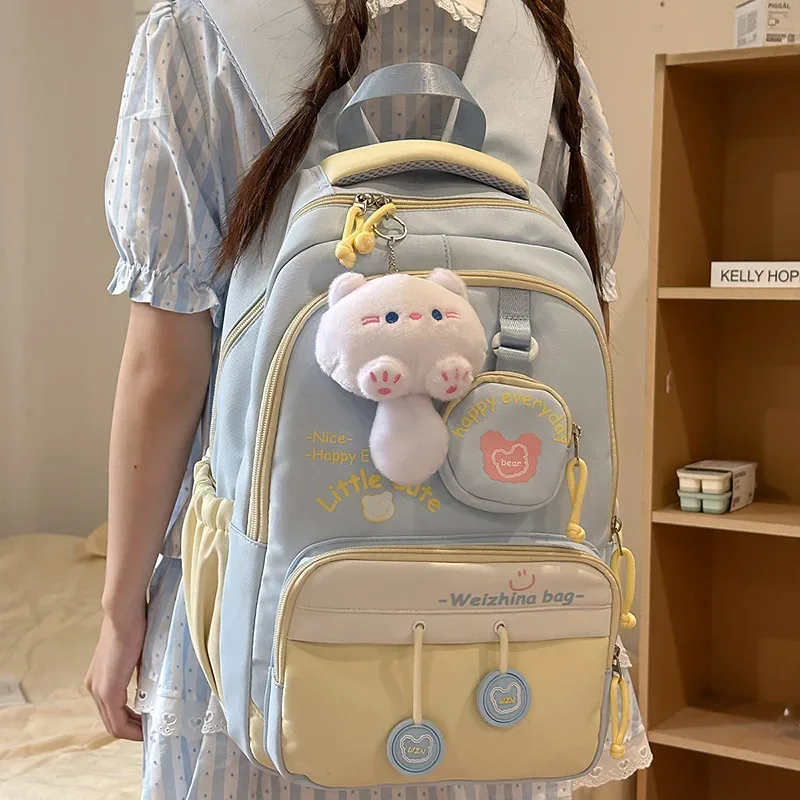 nouveau sac à dos de couleur contrastée de grande capacité pour les élèves du secondaire et du secondaire sac à bandoulière double mignon pour femmes matériau en nylon...