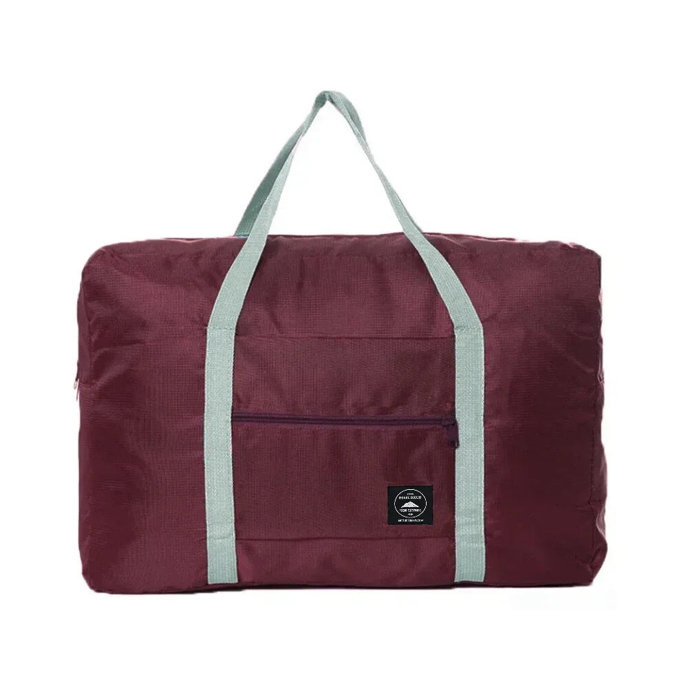 sac de voyage pliable de grande capacité, imperméable et résistant à l'usure, peut être porté à la main et stocké sur une épaule à la maison.