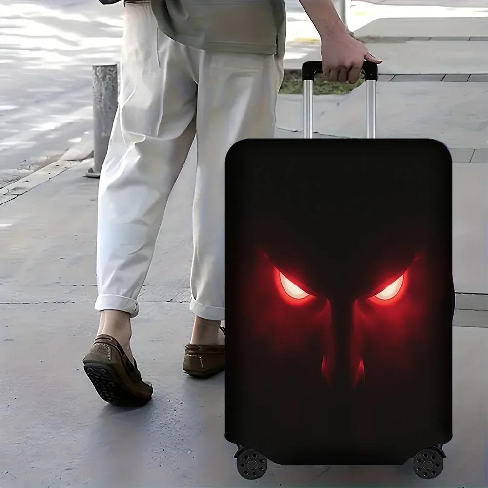 1 housse de bagage à imprimé œil du diable rouge. Convient aux valises de 18 à 32 pouces ; protège efficacement vos bagages.