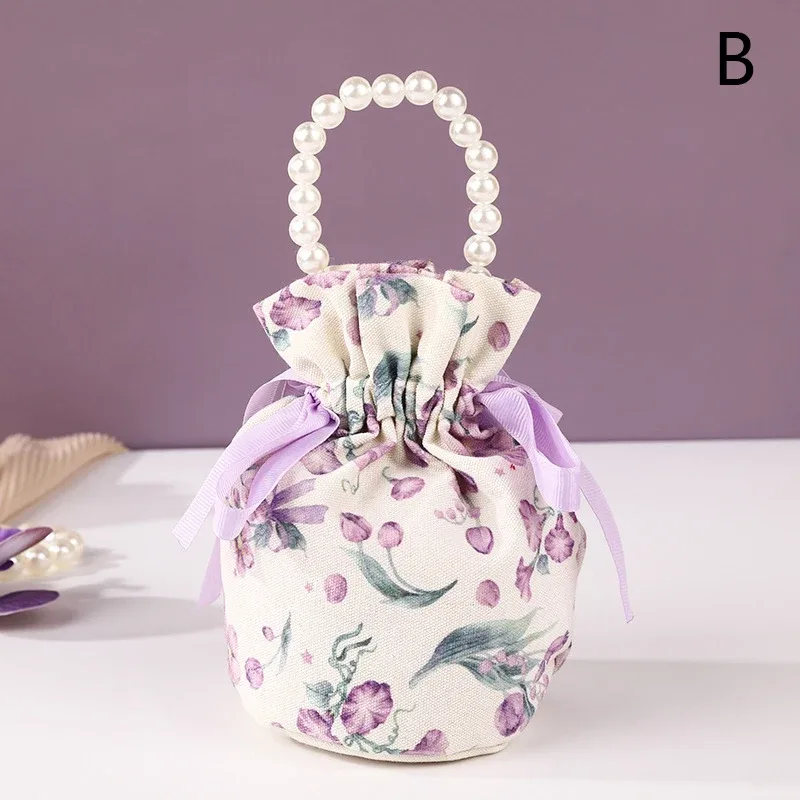 sac à cordon en toile florale, petite pochette à bijoux avec nœud papillon avec poignée en chaîne de perles, sac d'emballage de bonbons de mariage