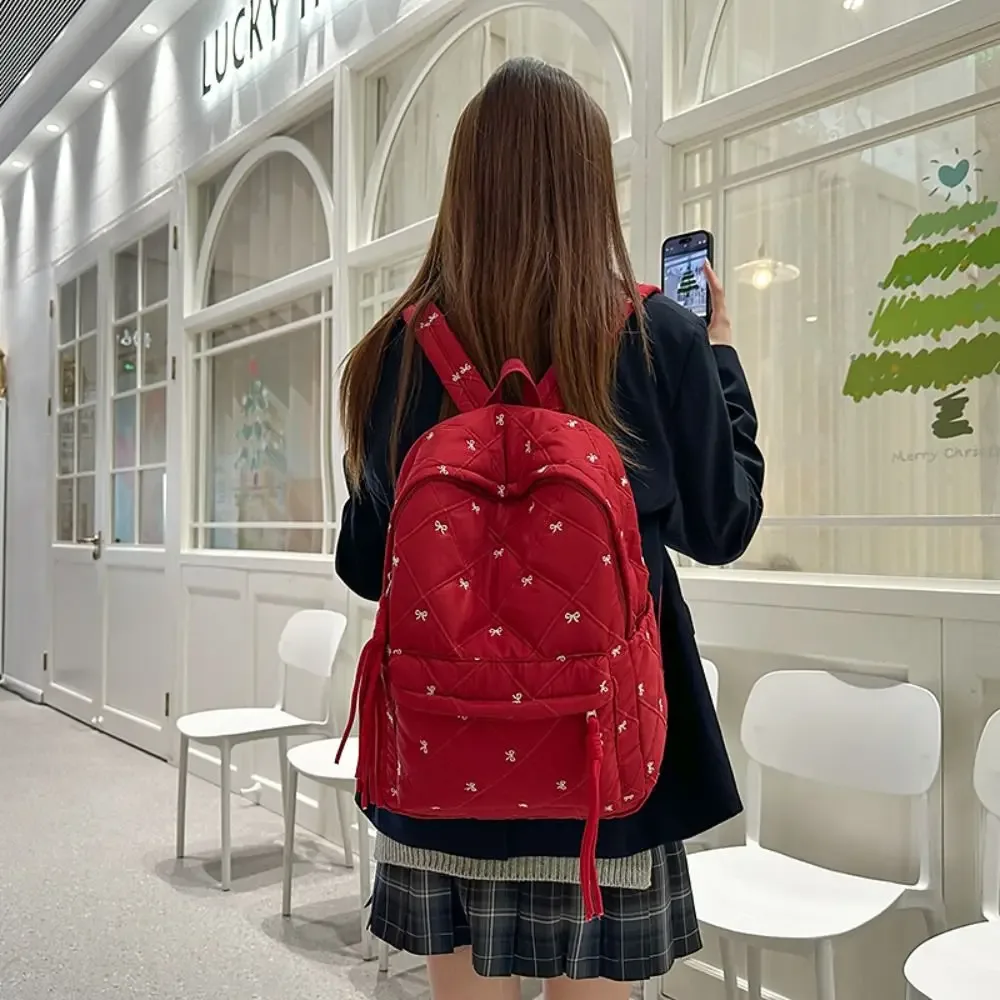 Sac à dos léger en nylon avec nœud brodé, style preppy, sac à dos portable pour étudiants, idéal pour l'école et les activités de plein air.