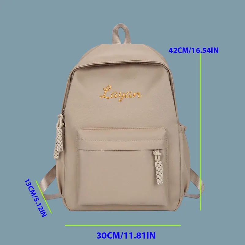 sac à dos personnalisé brodé - style universitaire, fabriqué en tissu uni de haute qualité, grande capacité, élégant et simple.