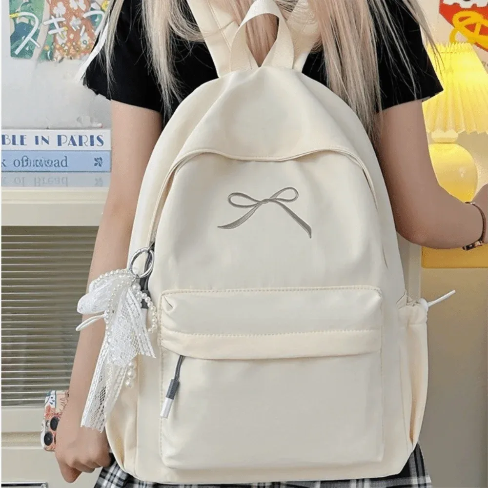 Sac à dos portable pour filles avec nœud brodé, couleur unie, grande capacité, sac d'école pour étudiants, sac à dos de voyage léger en nylon