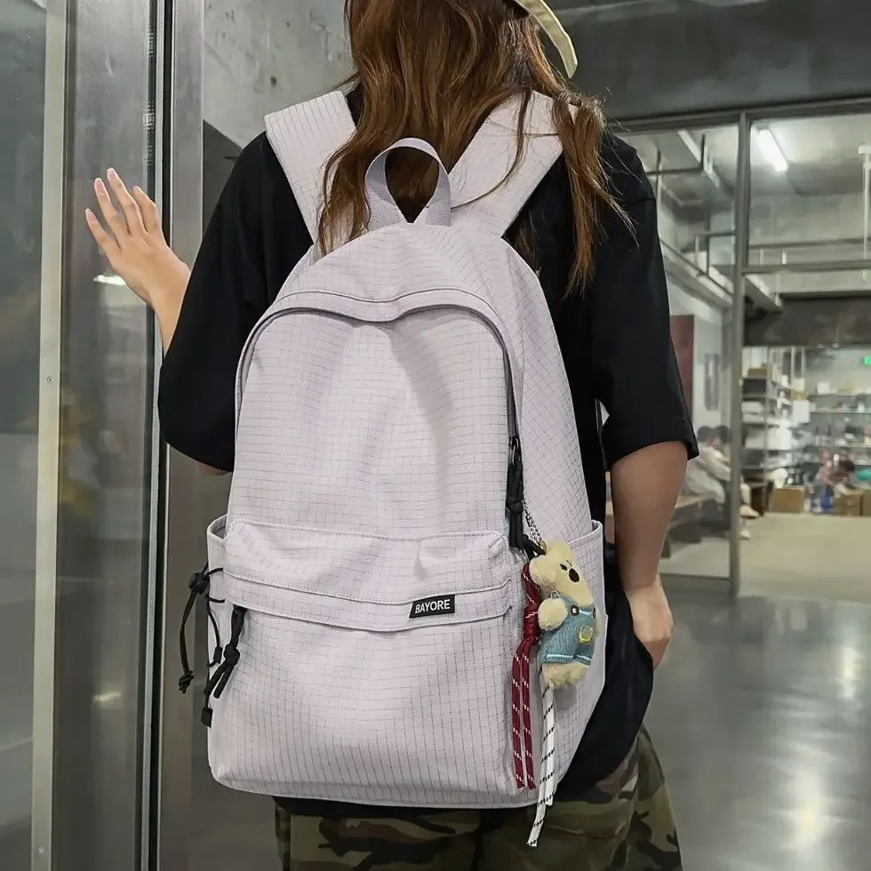 sac à dos de voyage décontracté grande capacité pour homme, motif quadrillé simple, sac d'école en nylon, style campus jeune, système anti-gravité