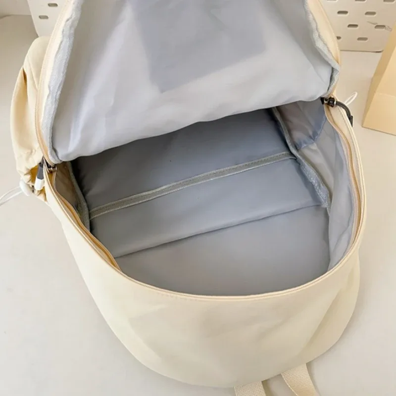 sac à dos portable brodé avec nœud pour filles, sac d'école en nylon de couleur unie pour étudiants, sac à dos de voyage léger de grande capacité pour femmes