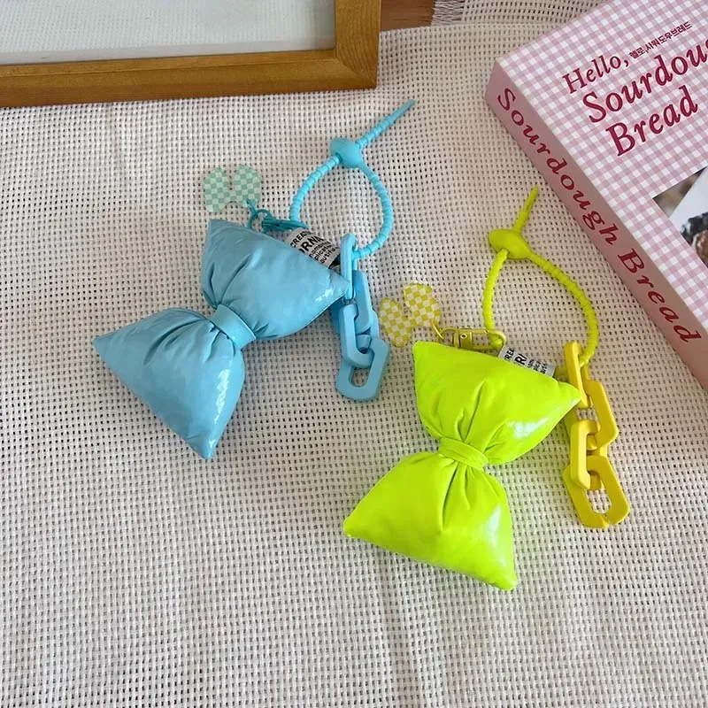 porte-clés en cuir et coton avec nœud doux pour fille, pendentif simple et mignon pour sac à dos, décoration de sacs