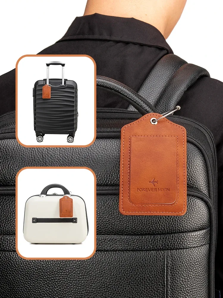 Étiquette de bagage en cuir PU avec boucle de câble anti-perte et couvercle de protection de la vie privée intégré, adaptée aux bagages et sacs de voyage.