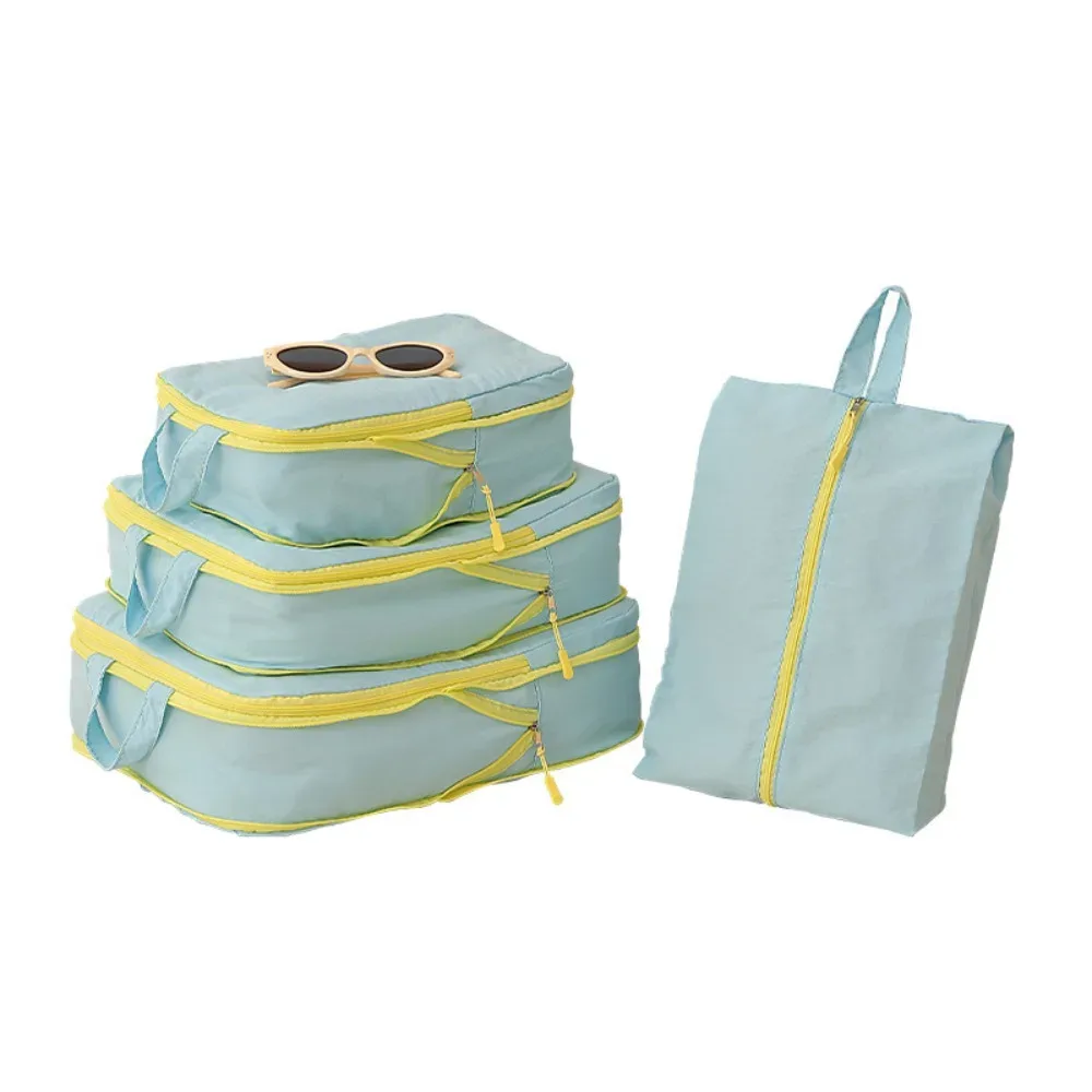 cubes de rangement taslan jaunes, ensemble de quatre pièces, organisateur de bagages à compression pour gagner de la place avec sac à chaussures pour les voyages en cabine et les vacances