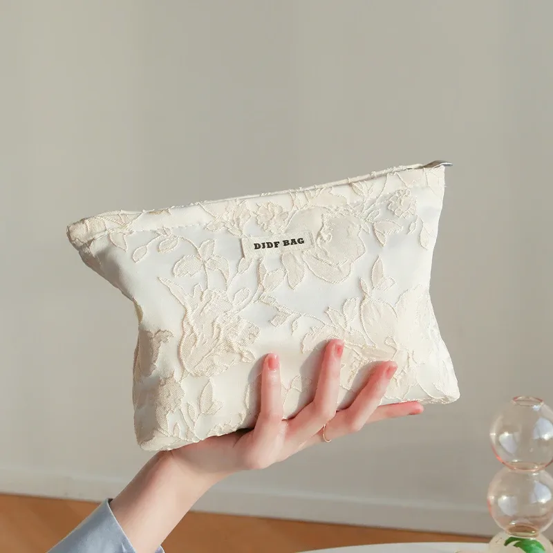 nouveau sac cosmétique femme de petite taille portable bleu broderie mini sac de rangement de serviettes hygiéniques sac de clé de monnaie de banlieue sac de carte bancaire