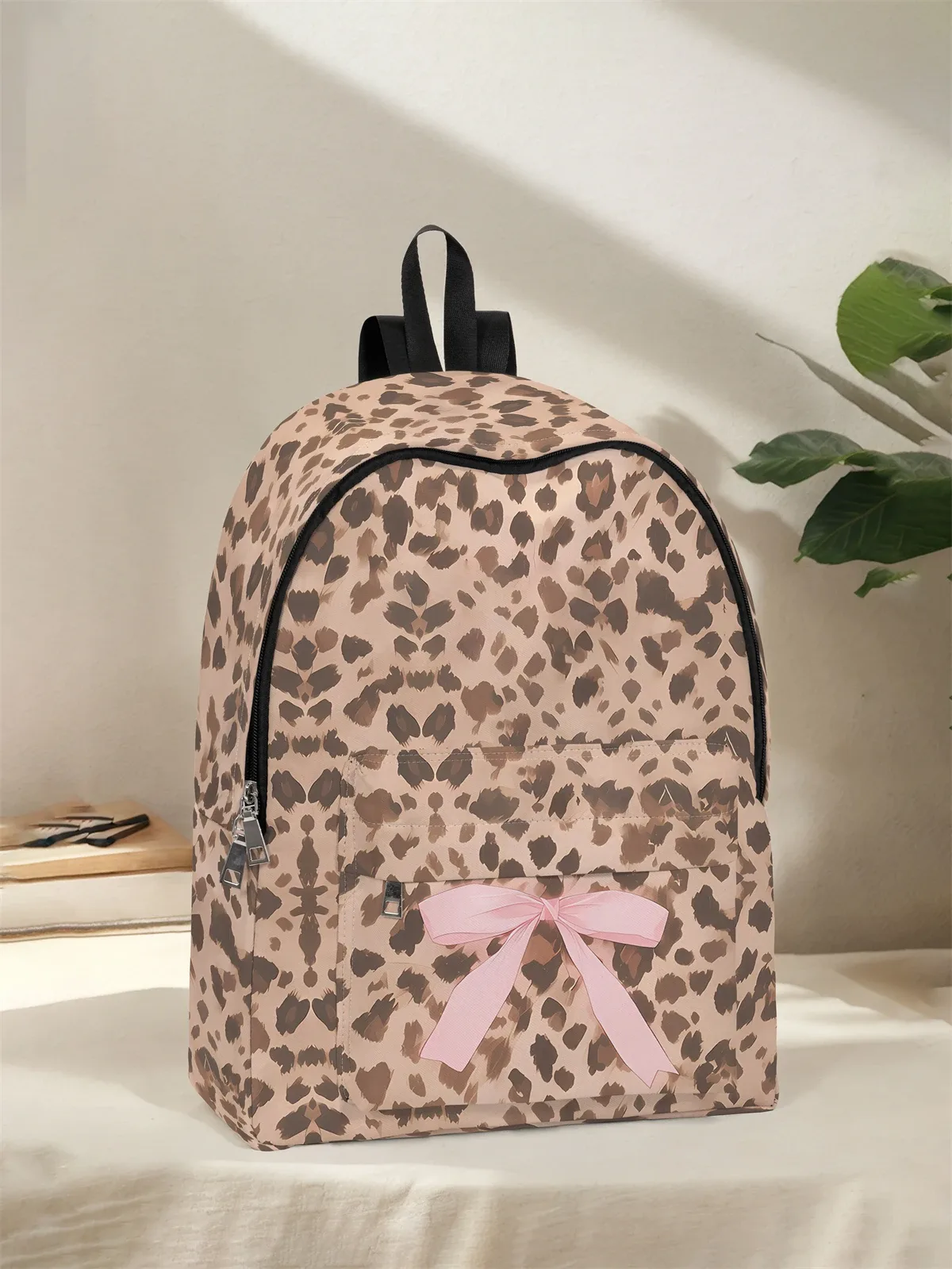 sac à dos à motif léopard et nœud, nouveau modèle 2025, sac à dos de voyage décontracté, léger et simple.