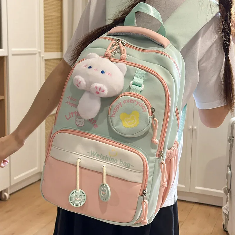 nouveau sac à dos de couleur contrastée de grande capacité pour les élèves du secondaire et du secondaire sac à bandoulière double mignon pour femmes matériau en nylon...