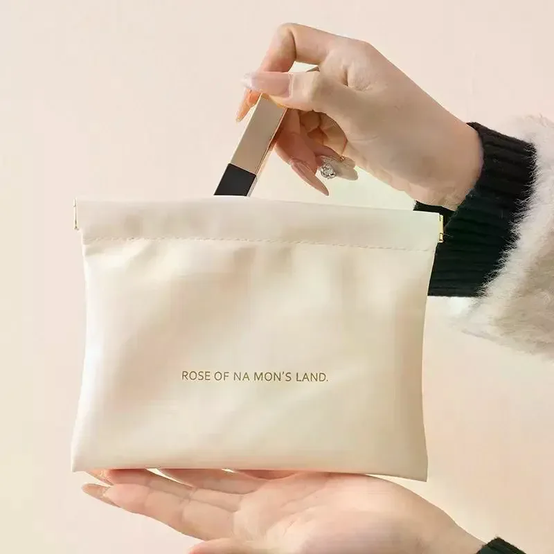 Sac de rangement en cuir PU, sac de rangement à fermeture automatique, sac à main étanche, ligne de chargement d'écouteurs portables, sac de bijoux de rouge à lèvres cosmétique