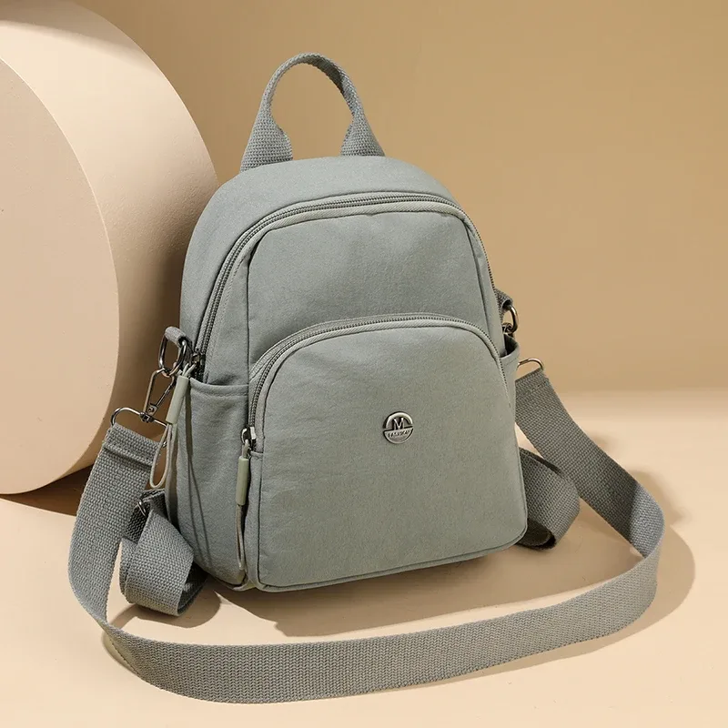 Petit sac à dos léger de voyage décontracté pour femmes, sac à bandoulière en tissu imperméable de grande capacité et sensation haut de gamme pour filles, nouvelle collection