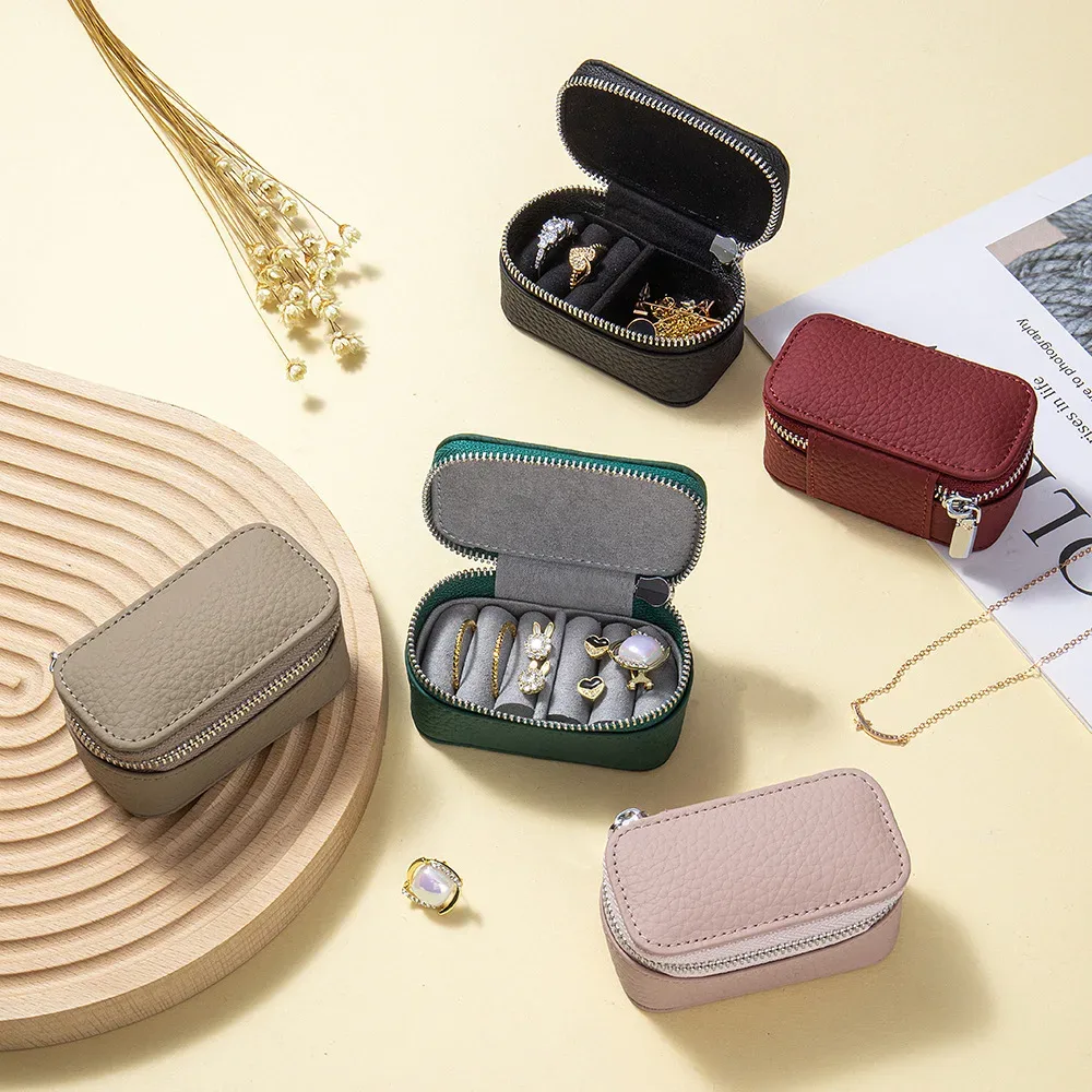 Boîte à bijoux portable en cuir véritable pour voyage, boîte à bagues, colliers et boucles d'oreilles, mini pochette de rangement cosmétique pour femme, pochette de soirée